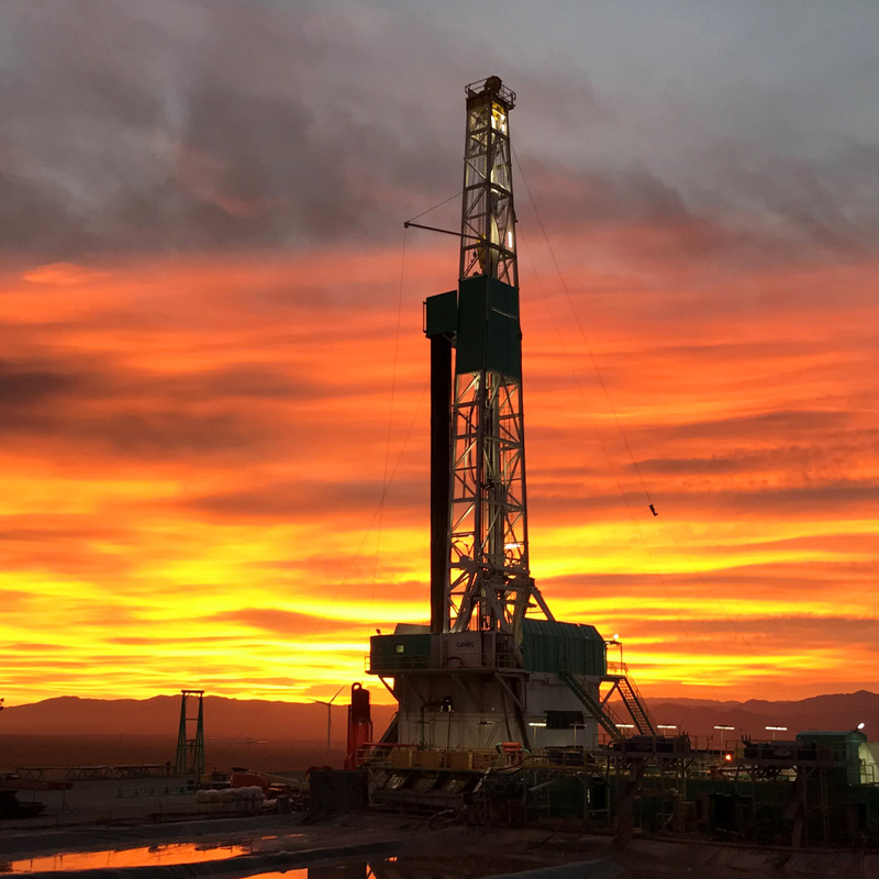 Utah FORGE well 16a drill rig at sunset.