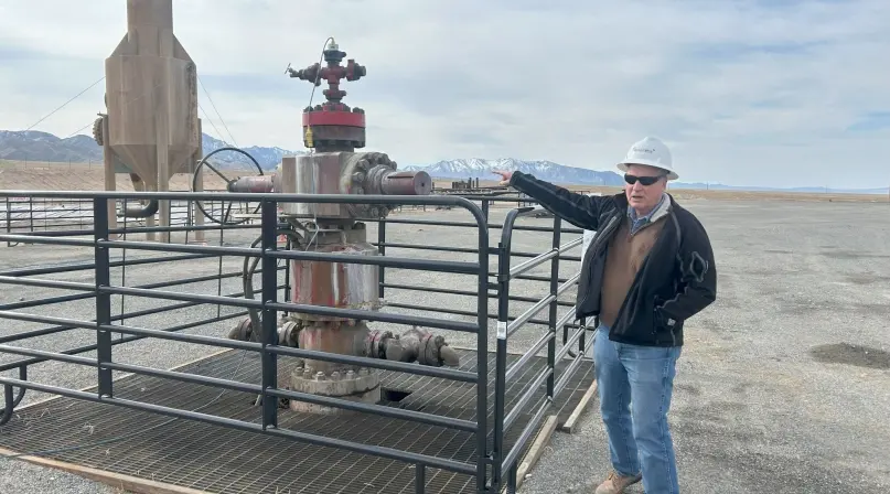 mclennan_0 John McLennan stands beside a geothermal wellhead at the Utah FORGE site in Beaver County, Utah, highlighting local involvement in advancing enhanced geothermal systems. Photo by Charlie Ban.
