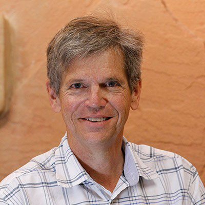 Portrait of Dr. Stuart Simmons, Technical Expert on Geology and Geochemistry at Utah FORGE and Research Professor at the University of Utah, with over 30 years of experience studying geothermal systems and hydrothermal fluid flow.